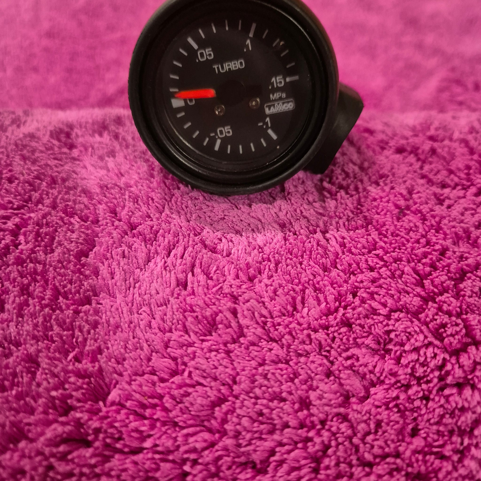 Lamco Boost Gauge Black face with housing.