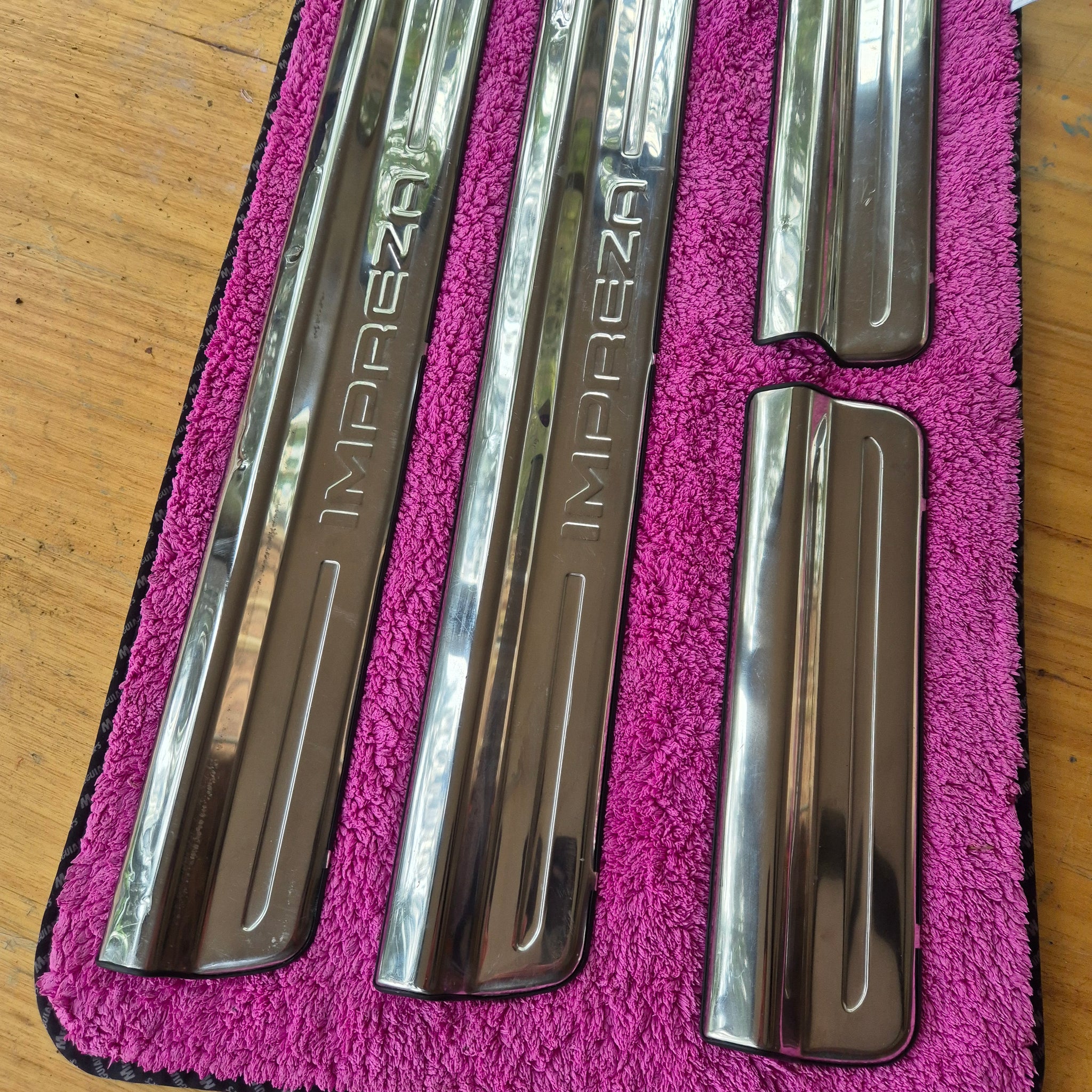 OEM original, used condition Subaru Impreza Sedan/Wagon sill protectors