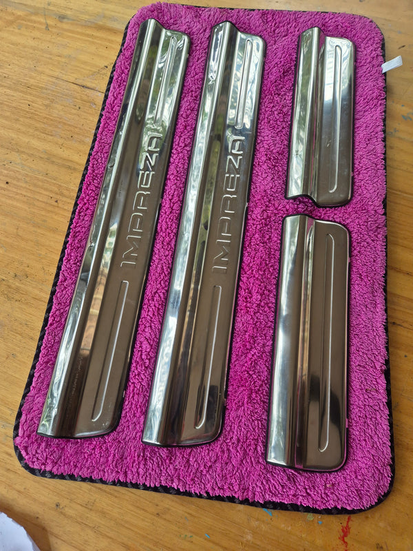 OEM original, used condition Subaru Impreza Sedan/Wagon sill protectors